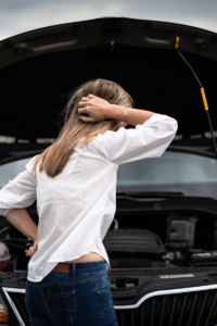 Woman with broken down car